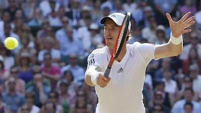 Andy Murray of Britain returns to Novak Djokovic of Serbia during the men's final at Wimbledon.