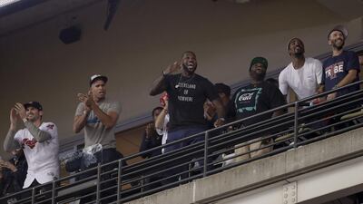 LeBron James watches during the eighth inning. Matt Slocum / AP