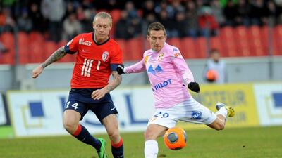 Evian, in pink, held Lille, in red, to a draw on Sunday. Evian are 17th in the Ligue 1 table. Jean-Pierre Clatot / AFP