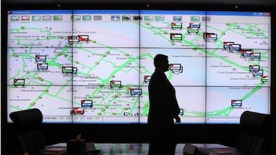 Siraj Ismail, enterprise risk manager, shows the water taxi and bus routes on the screen during a meeting at RTA’s Crisis Operations Centre in Dubai. Pawan Singh / The National
