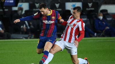 Athletic Bilbao's Dani Garcia challenges Lionel Messi. AFP