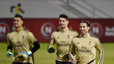 Real Madrid's Alphonse Areola, Diego Altube and Sergio Ramos attend a training session. AFP