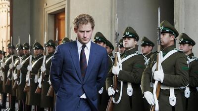 Britain’s Prince Harry walks past the honour guard as he arrives to meet with Chile’s President Michelle Bachelet at the La Moneda Presidential Palace in Santiago, June 27, 2014. Prince Harry is in Chile for a 3-day tour. Reuters