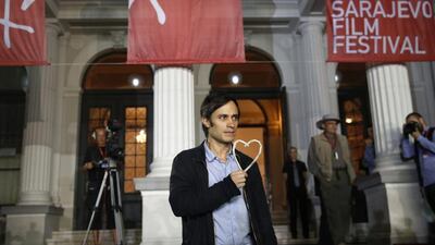 Mexican actor Gael Garcia Bernal poses with the Heart of Sarajevo honorary award during the 20th Sarajevo Film Festival in Sarajevo, August 15, 2014. Sarajevo’s film festival, founded as an act of defiance while the city was besieged during the 1992-95 Bosnian war, marks its 20th anniversary on Friday with its biggest line-up of movies. Reuters