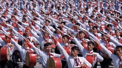 Students march past a balcony from where North Korea's leader Kim Jong Un was watching, during a mass rally on Kim Il Sung square in Pyongyang. AFP