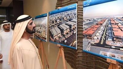 Sheikh Mohammed bin Rashid looks at the plans for Dubai Wholesale City. Courtesy Wam