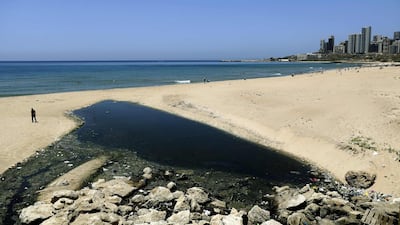 Contaminated water from sewage pipes pours on the sand of the public beach of Ramlet al-Bayda in the Lebanese capital Beirut. AFP