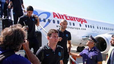 Barcelona players Lionel Messi, Javier Mascherano and Luis Suarez deplane upon arrival in Rome on Tuesday ahead of their Champions League match on Wednesday against AS Roma. Telenews / EPA