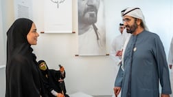 Sheikh Mohammed bin Rashid views the research project documenting the history of Al Khuzam. Photo: Wam
