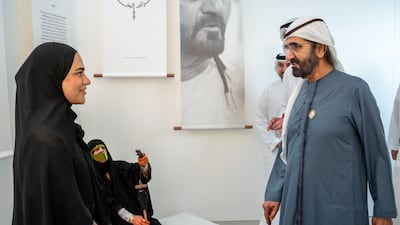 Sheikh Mohammed bin Rashid views the research project documenting the history of Al Khuzam. Photo: Wam