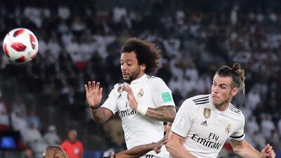 Gareth Bale, right, and Marcelo of Real Madrid compete with Al Ain's Mohamed Fayez in the Club World Cup final at Zayed Sports City Stadium, Abu Dhabi. Chris Whiteoak / The National