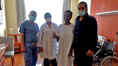 L-R: Dr Hossam Helmy, ICU consultant, Dr Mona Cheetan, neurology consultant, patient Mujeeb and Dr Mohamed Khamis. Staff at Al Zahra Hospital in Dubai cared for Mujeeb for 55 days Courtesy: Al Zahra