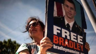 A supporter of Bradley Manning protests outside the main gate before the reading of the verdict in Manning's military trial at Fort Meade, Maryland.