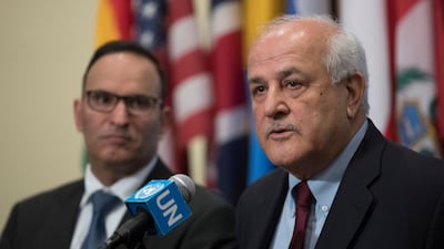 Riyad Mansour (R), Palestinian ambassador to the UN, speaks to the media after an emergency Security Council meeting on the situation in Gaza on March 30, 2018. AP