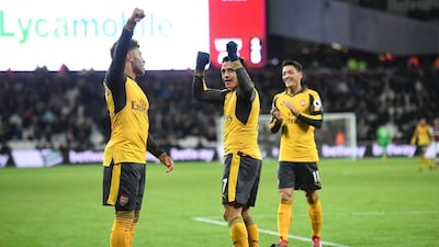 Arsenal’s Alexis Sanchez, left, Mesut Ozil, right, and Alexandre Lacazette will be out in force against West Brom this weekend. Justin Tallis / AFP