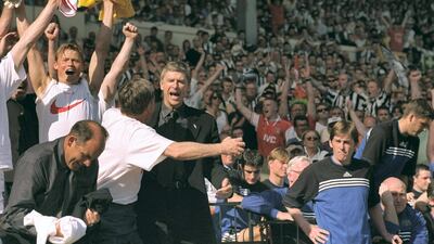 Arsene Wenger celebrates with the Arsenal bench after beating Newcastle United 2-0 to win the FA Cup final at Wembley Stadium in London on May 16, 1998. Getty