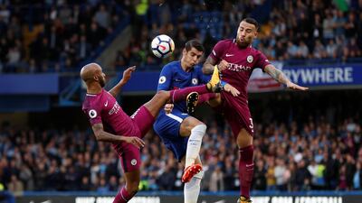 Chelsea’s Alvaro Morata, centre, in action against Manchester City's Nicolas Otamendi, right, and Fabian Delph before the Spaniard was withdrawn through injury. John Sibley / Reuters