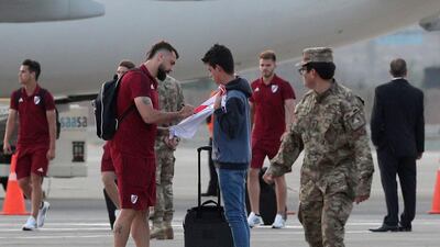 Lucas Pratto of River Plate signs a fan's t-shirt after his team arrived in Peru for Saturday's Copa Libertadores final. AP
