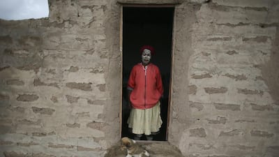 Sixty-two-year-old South African woman Olivia Tsangane, a neighbour of late South African president Nelson Mandela, poses for a photograph in Mandela’s ancestral village of Qunu, South Africa. Nic Bothma / EPA