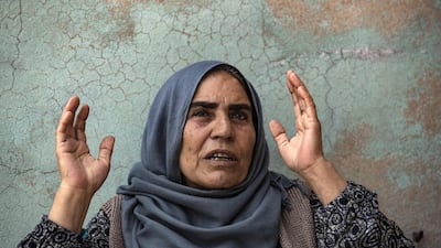Displaced from the border town of Ras Al Ain, Syrian Kurdish mother Shara Sido, 65, who's son was allegedly shot dead by Turkey-backed Syrian fighters, sits inside a house in the de-facto Syrian Kurdish capital of Qamishli. AFP