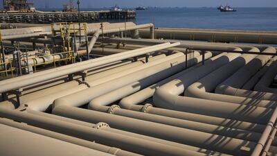 Oil pipelines sit on the quayside beside the Arabian Sea at the North Pier terminal in Saudi Aramco's Ras Tanura oil refinery in Saudi Arabia. UBS expects Brent to average $75 per barrel by December, from an average of $70.6 per barrel. Bloomberg