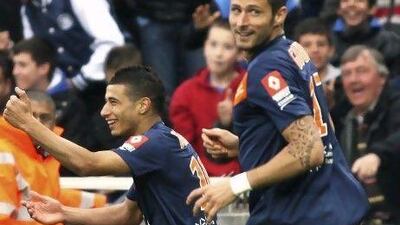 Montpellier’s Younes Belhanda, left, and Olivier Giroud celebrate a goal last month, but had an on-field spat last weekend.