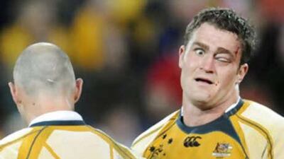The Australian James Horwill has his eye closed after clashing with the French forwards.
