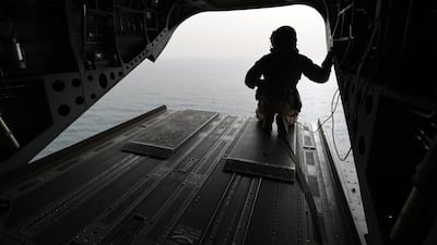 An Emirati soldier watches on from a military plane on a ship crossing through the strategic strait of Bab Al Mandab, which separates the Arabian Peninsula from east Africa. AFP