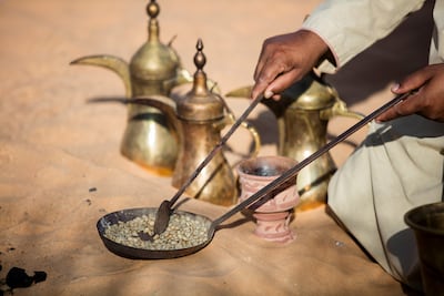 The coffee beans are roasted on a clay stove called al qawar. Photo: Crown Prince Court - Abu Dhabi