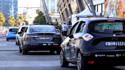 A Renault Zoe, foreground, and Tesla Model S at Adnec. Victor Besa / The National