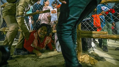 Anguish at the site of a crush, which occurred at about 1am local time. AFP