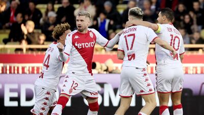 Monaco's Aleksandr Golovin (2R) is congratulated by teammates after scoring the first. AFP