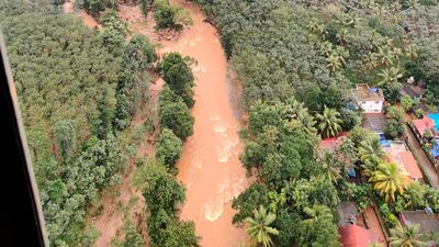 Scenes after a landslide triggered by heavy rains in the Western Ghats mountains in Koottickal, Kottayam district. AP