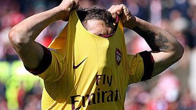 Arsenal's Jack Wilshere reacts after his team's loss to Stoke City.