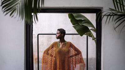 A model poses wearing a creation by Nigerian designer Bubu Ogisi's brand Iamisigo before a presentation of the spring/summer 2026 collection at Lagos Fashion Week. AFP