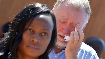 A man cries after paying his respects to late South African president Nelson Mandela on the last day of Mandela's lying in state at the Union Buildings in Pretoria. Alexander Joe / EPA