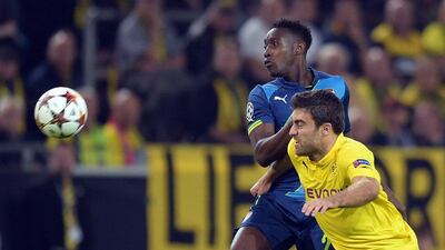 Arsenal forward Danny Welbeck and Borussia Dortmund's Sokratis vie for the ball during the Uefa Champions League match on Tuesday night. Federico Gambarini / AFP / DPA / September 16, 2014