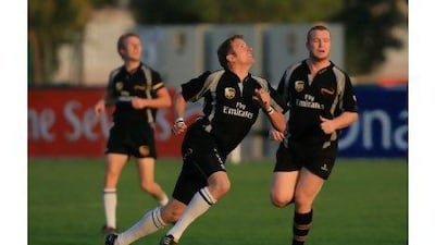 Steve Smith, centre, chases down a quick during action at The Sevens Complex.