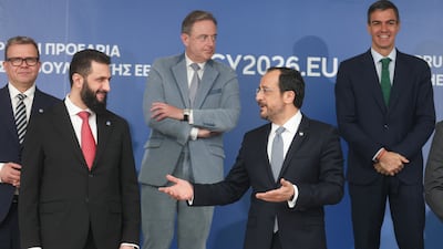 Syrian President Ahmad Al Shara, left, speaks with Cypriot President Nikos Christodoulides. EPA