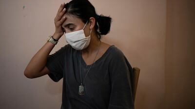 Rachelle Boumelhem reacts during an interview in her damaged beauty salon in Beirut, Lebanon, Monday, August 10, 2020. AP