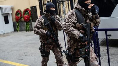 Turkish police officers stand guard outside the Russian consulate in Istanbul on December 20, a day after the assassination of the Russian ambassador in Ankara. Yasin Akgul / AFP Photo