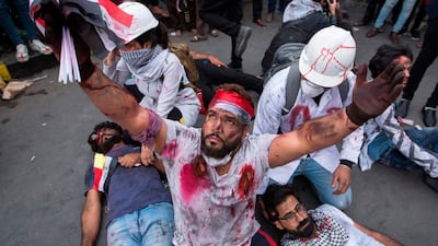 Actors perform a play representing the ongoing anti-government demonstrations in Tahrir Square. AFP