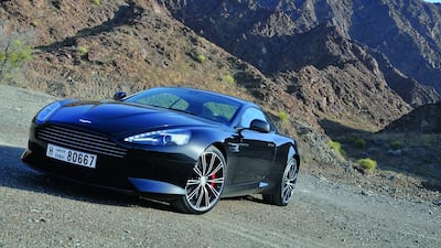 The DB9 Carbon Edition sticks with its dark livery both inside and out, with a lack of brightwork and a carbon-fibre-swathed interior. Kevin Hackett / The National