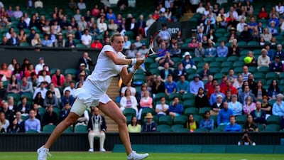 Petra Kvitova returns a shot to Barbora Zahlavova Strycova during her fourth round win at the 2014 Wimbledon Championships on Tuesday. Carl Court / AFP / July 1, 2014