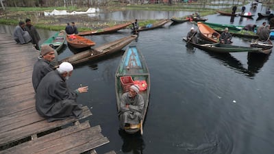 Vegetable dealers wait on their boats at a floating market on Dal Lake in Srinagar, Kashmir, India. Kashmiri boatmen earn a living by selling vegetables produced in the lake, ferrying tourists and cleaning the lake of weeds, while women are often seen selling fish. EPA
