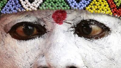 A Congolese soccer fan looks out over the soccer pitch during the African Cup of Nations semifinal soccer match between Congo and Ivory Coast in Bata, Equatorial Guinea, Wednesday, Feb. 4, 2015. (AP Photo/Themba Hadebe)