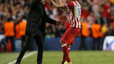 Atletico Madrid striker Diego Costa celebrates with coach Diego Simeone after scoring against Chelsea on Wednesday in the Champions League. Stefan Wermuth / Reuters / April 30, 2014