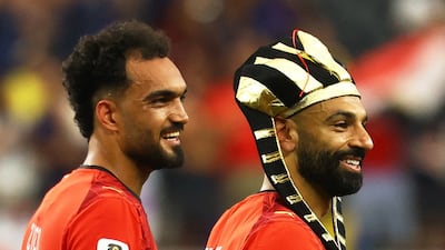 Egypt's Mostafa Zico and Mohamed Salah celebrate after the match. Reuters