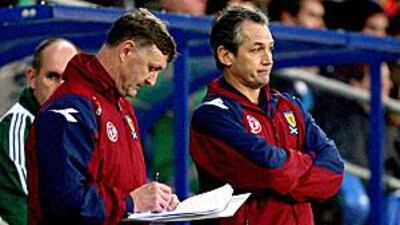 George Burley, right, watches Scotland lose to Wales.