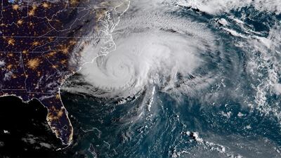 This satellite image provided by NOAA shows Hurricane Florence off the eastern coast of the United States on Thursday, Sept. 13, 2018. NOAA via AP